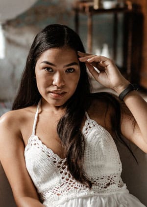 Young woman smiling representing mental health recovery and wellbeing